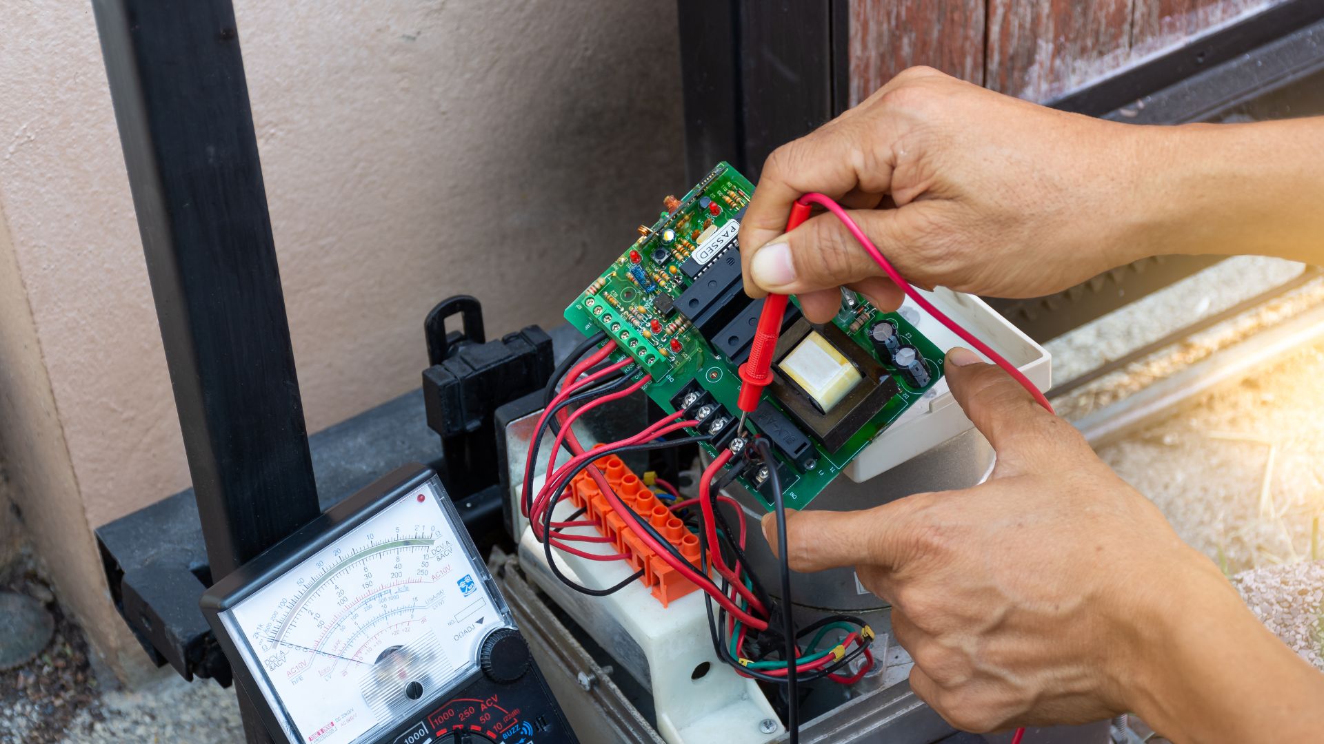 Technician testing electrical circuit with multimeter and probe