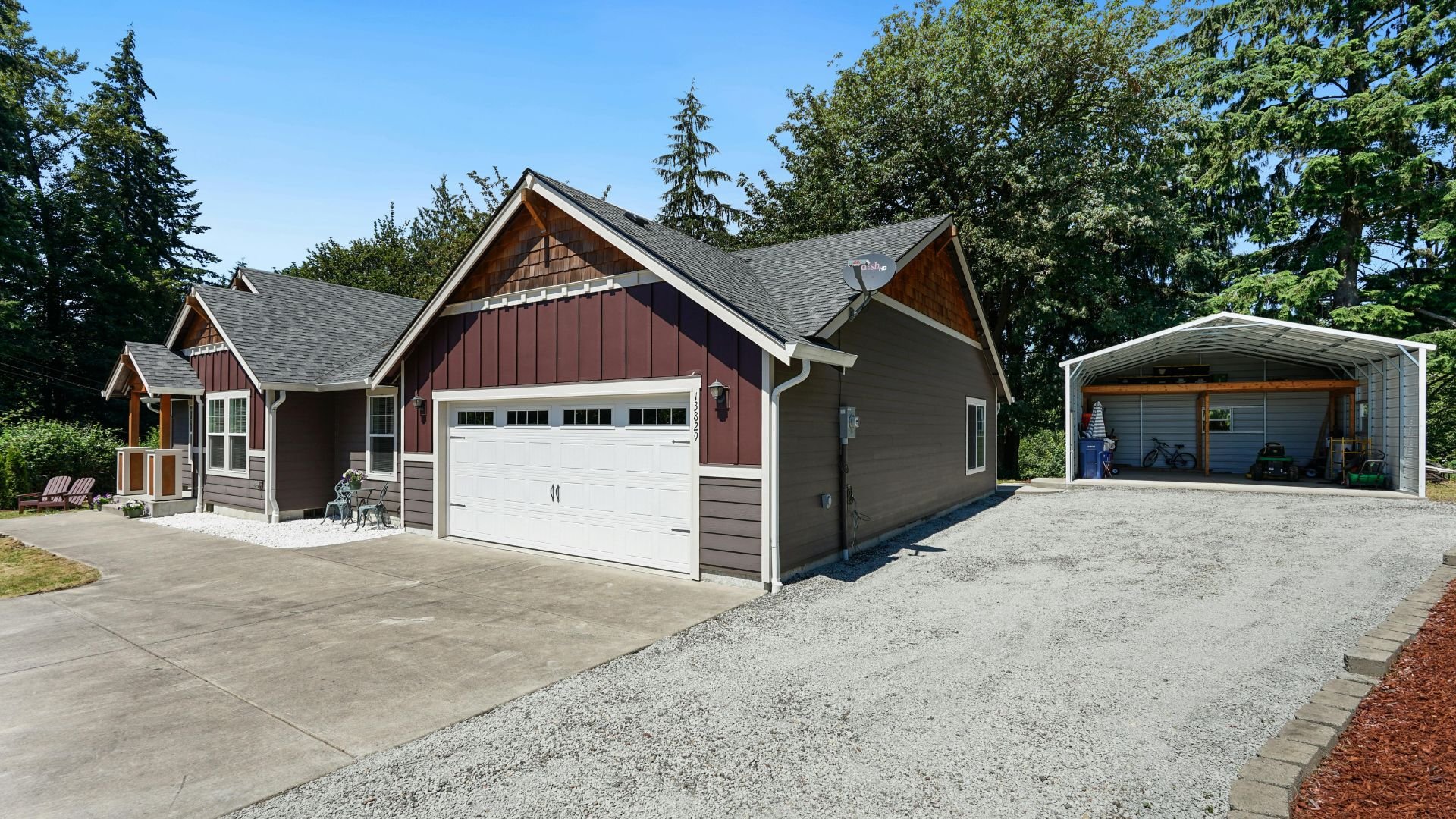 Modern suburban house with attached garage and separate storage shed